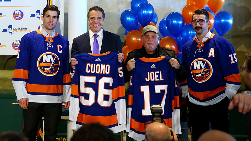 John Tavares, Andrew Cuomo, Billy Joel, and Cal Clutterbuck at the announcement of the Belmont Arena in December 2017.